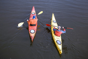 Traveling by kayak on the river on a sunny day.