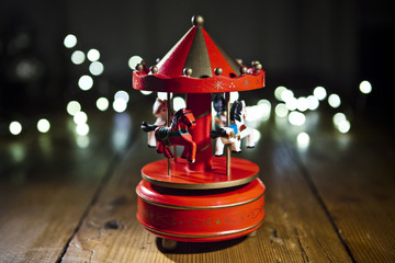 Red carousel toy with blur lights