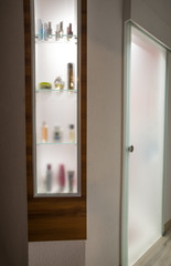 Fototapeta na wymiar Glazed shelf with backlight