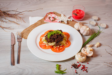 roasted meat with tomatoes on a beautiful decor