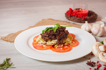 roasted meat with tomatoes on a beautiful decor