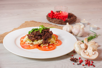 roasted meat with tomatoes on a beautiful decor