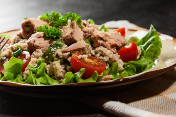 Tasty salad with couscous, tuna and vegetables
