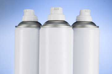 Aerosol spray cans nozzle closeup. Spray cans with shallow depth of field. Air freshener product studio photograph