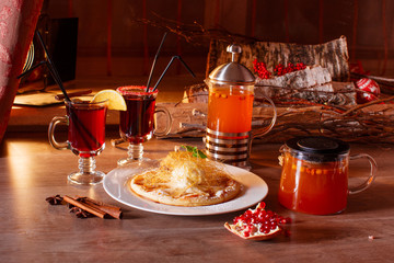 Hot buckthorn tea and mulled wine with decor