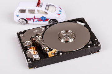 Obraz premium ambulance car on harddrive or hdd - data rescue concept