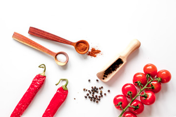 Fototapeta na wymiar spices in wooden spoon on white background top view