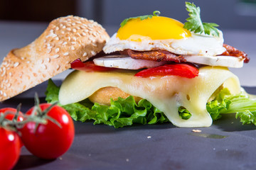 Sandwich with cheese, mushrooms and scrambled eggs.