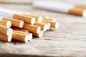 Tobacco cigarettes on a grey wooden table