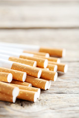 Tobacco cigarettes on a grey wooden table