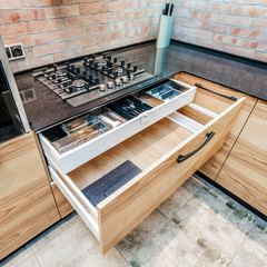 Modern kitchen. Opened drawers and cooker