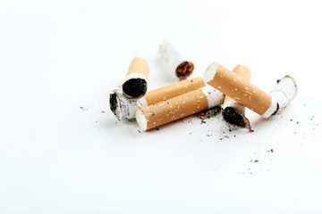 Cigarette butts with ash isolated on a white