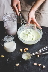 organic ice cream homemade process on dark background with hands