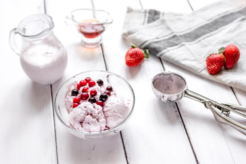 organic homemade ice cream in glass bowl on wooden background