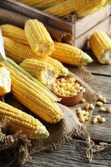 Sweet corns on a grey wooden table