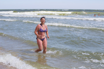 girl in bikini running