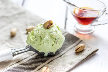 organic homemade ice cream in glass bowl on wooden background