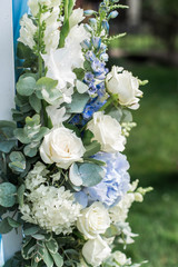Wedding arch, floral decorations in the garden. Collage