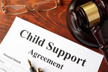 Child support agreement on an office table. - obrazy, fototapety, plakaty