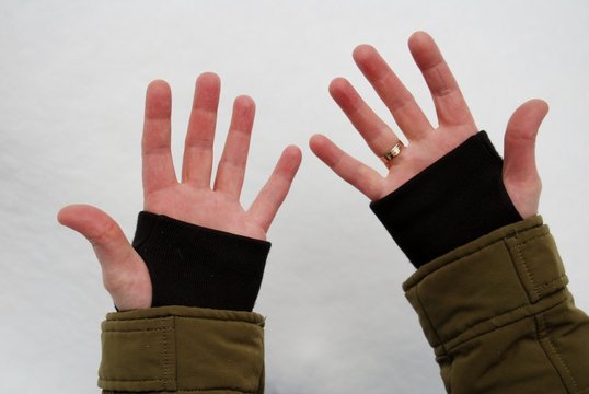female hands on a background of snow