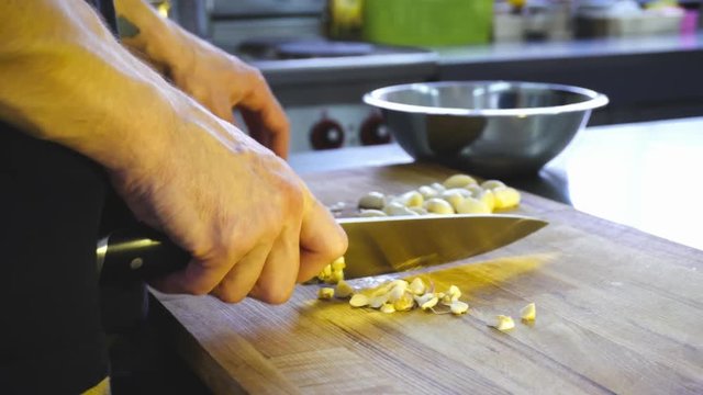 sliced garlic on a wooden Board. 