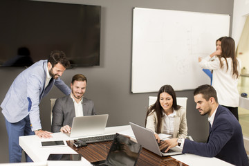 Young successful managers discussing new business project 