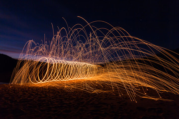 The work of glowing spiral sparks show.