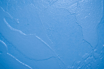 The texture of the surface of the painted cement walls