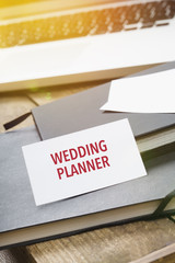 Card saying Wedding Planner on note pad