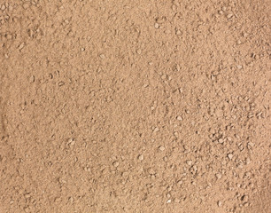  Close view of ground brown carob powder.
