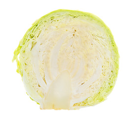 Organic cabbage half isolated on a white background.