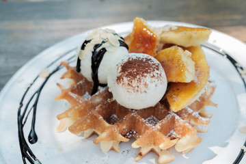 Close up of ice cream and waffle.