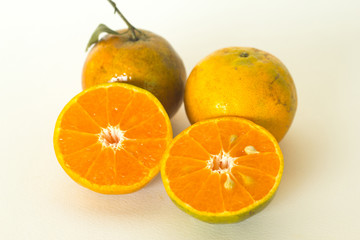 Ripe oranges isolated on white background. Orange in a cut