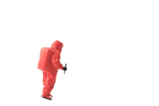 Miniature people  firefighter in hazmat suits construction concept