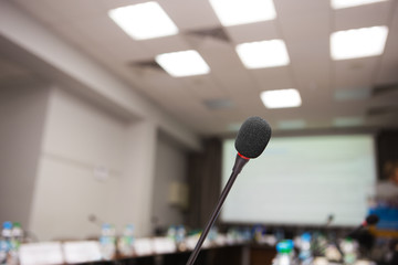 Close up of microphone in meeting room for conference. Blur background.