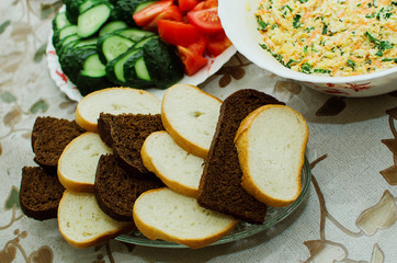 slices of white and black bread lie on a plate