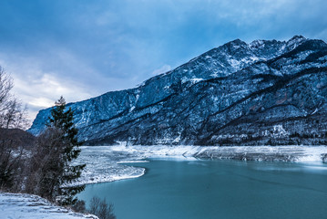 Dramatic winter landscape, mountain village in Trentino, Italy