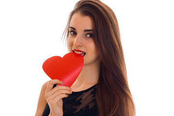 Valentine's day concept. Love . portrait of Young beautiful girl with red heart isolated on white background in studio