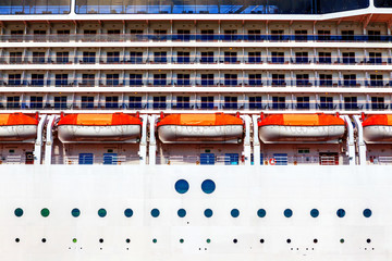 lifeboats on the side of cruiseship