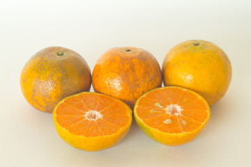 Ripe oranges isolated on white background. Orange in a cut