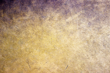 Bronze metal background closeup, matte texture with a golden hue