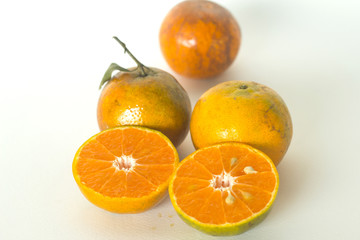 Ripe oranges isolated on white background. Orange in a cut