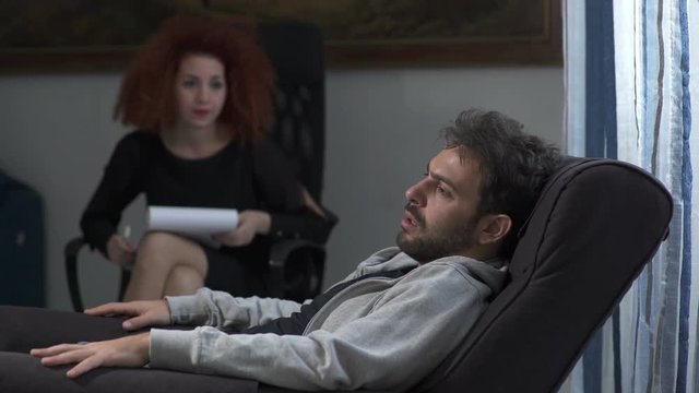 young therapist talks to a problematic patient