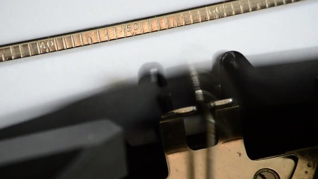 Typing the expression Chapter Two with an old manual typewriter