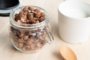 chocolate cereal cornflakes and milk for breafast