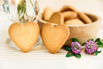 Heart shaped cookies on wooden table background