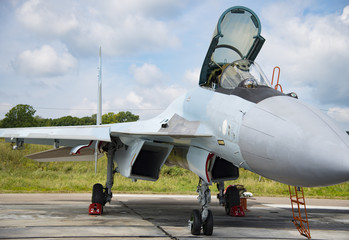Russian military aircraft on display military arms with open cockpit
