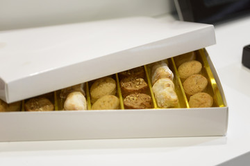 cookies in e white box on the table ready to eat