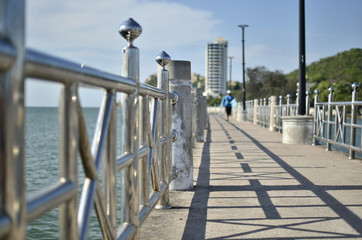 Fishing Pier (Selective focus) with fisherman 
