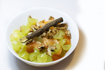 Fruit salad with grapes, walnuts, mandarin, tangerine...
